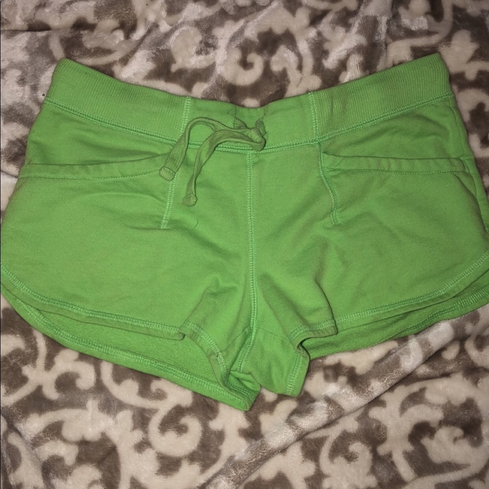 Green booty shorts.